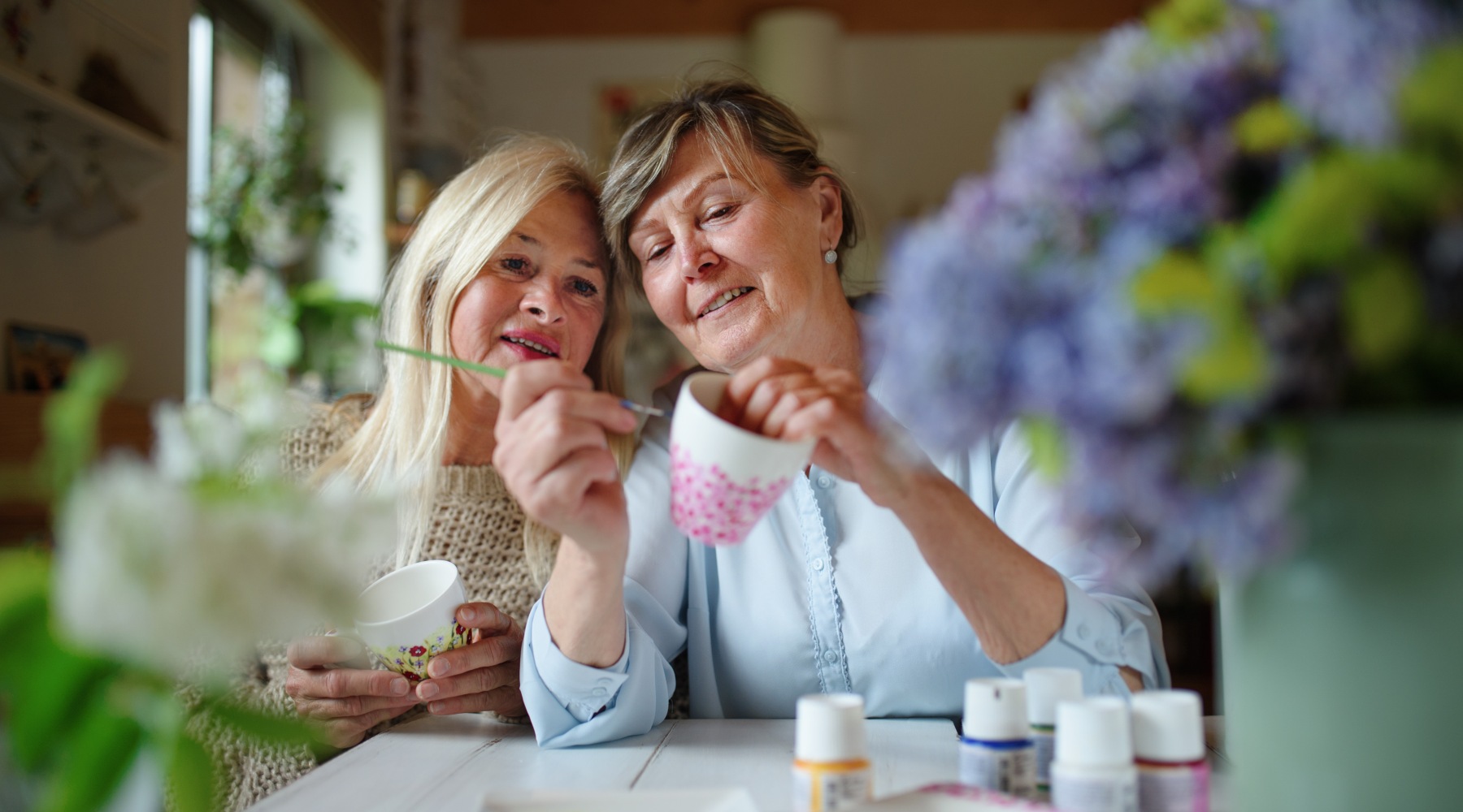 two woman painting